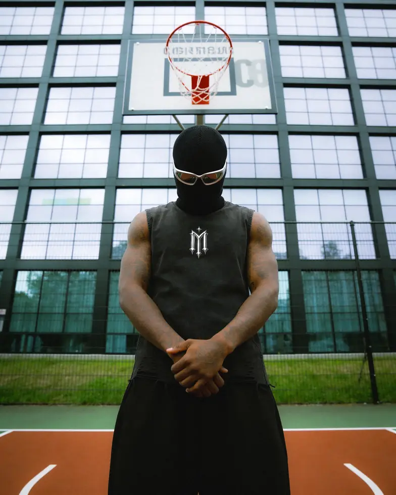 MIROSS washed sleeveless logo tee — basketball court hoop editorial
