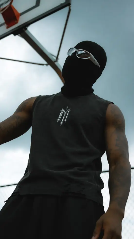 MIROSS washed sleeveless logo tee — masked low-angle editorial